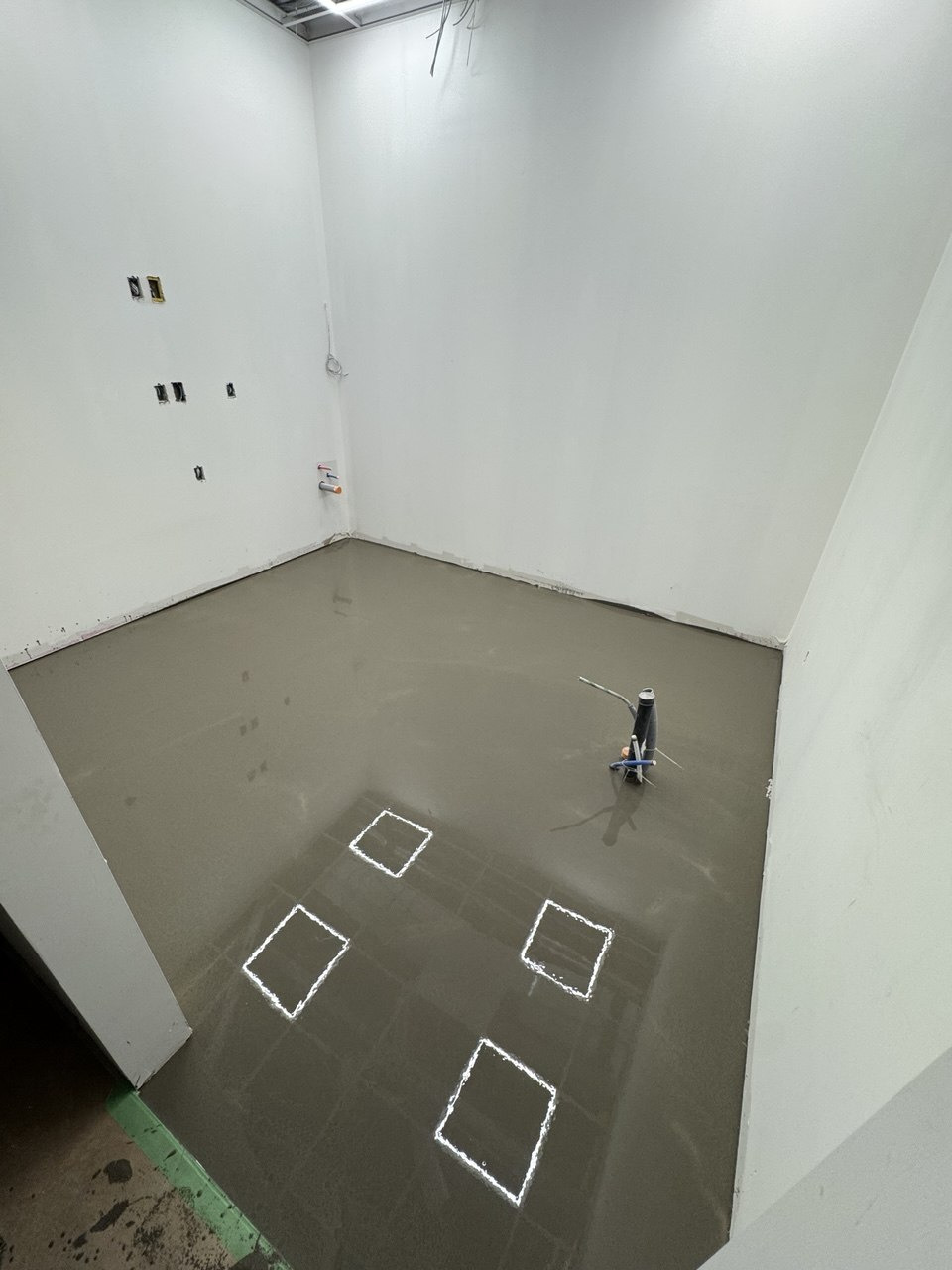 Floor leveling compound applied to an uneven subfloor to create a flat surface ready for finish flooring (view 4)
